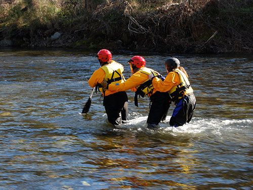 volunteers practicing water rescue