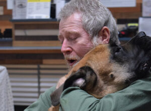 man reunited with rescued dog