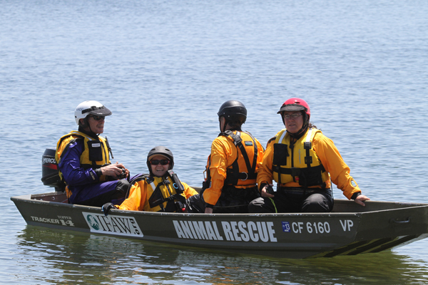 4 people in technical rescue boat