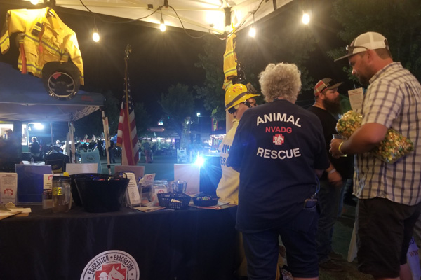 NVADG booth with volunteers and the public
